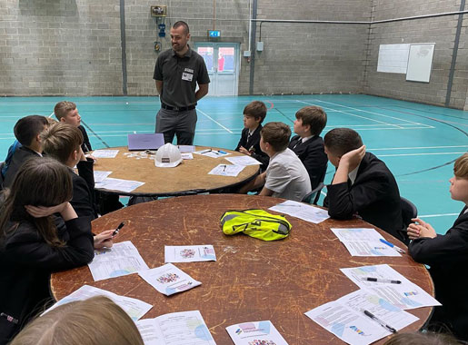 Andy talking to school students